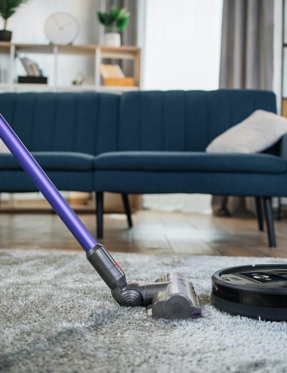 close-up-of-woman-cleaning-carpet-with-vacuum-cleaners.jpg